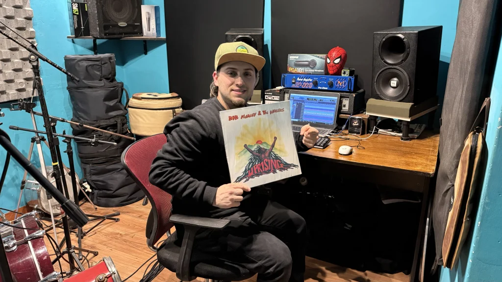 Ezequiel Drumkid recording a reggae drum pattern remotely wit Bob Marley's vinyl