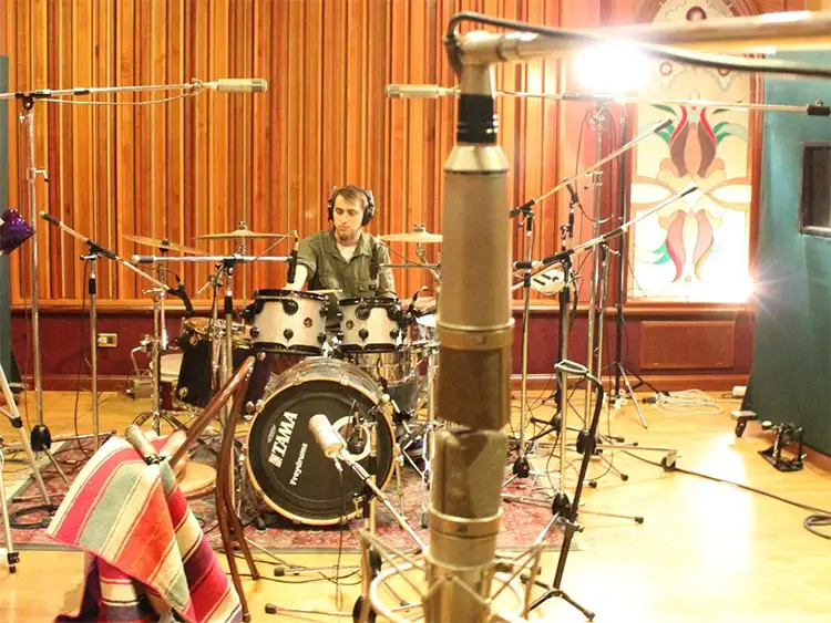 Drum kit miked up for remote session recording across reggae, rock, pop and funk