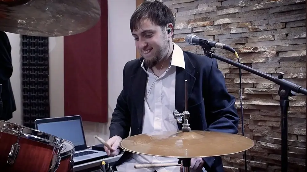 Drummer Ezequiel "Drumkid" playing during a live performance