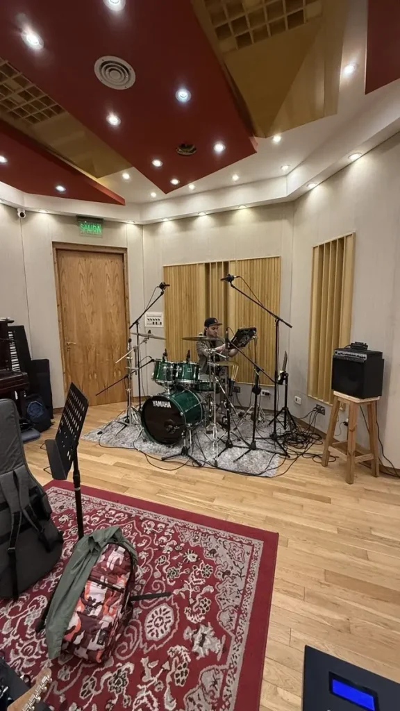 Drummer tracking a remote drum recording session on a Yamaha kit