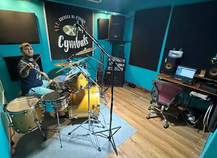 Online session drummer recording in professional home studio